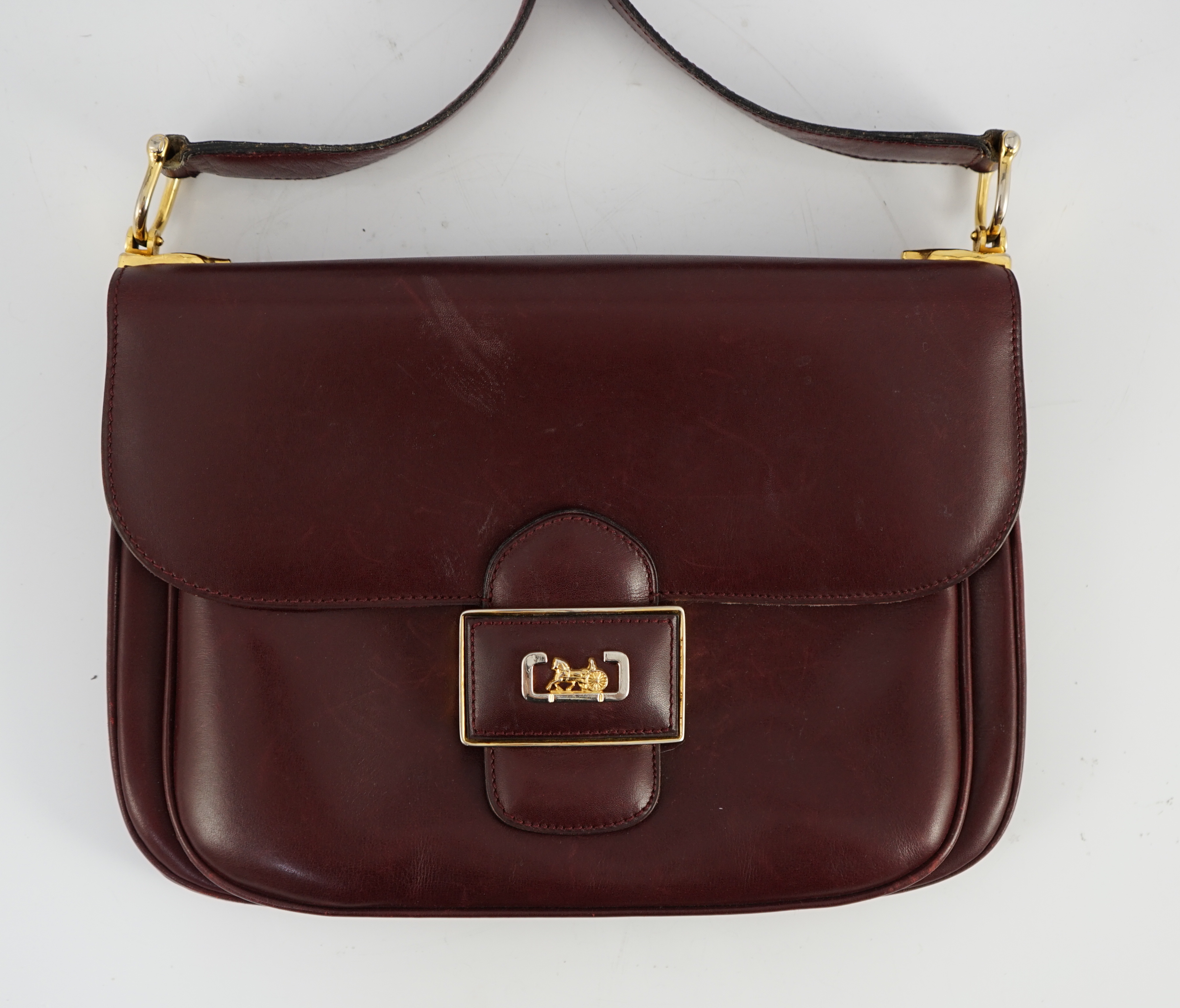 A vintage Celine horse carriage cargo flap burgundy leather shoulder bag, width 26cm, depth 3cm, height 18.5cm